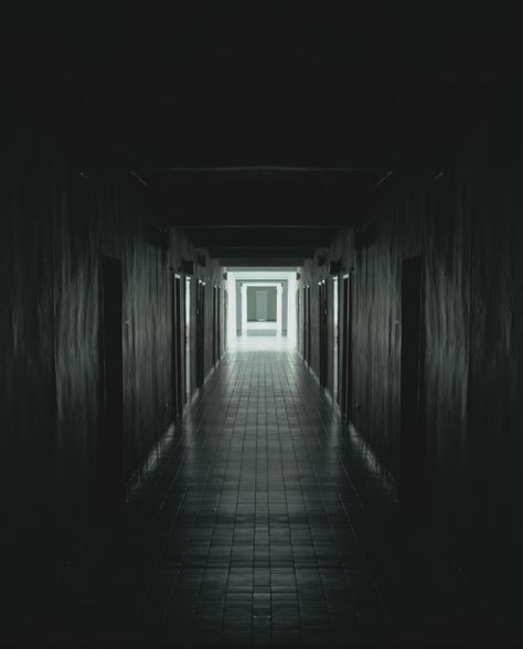 The mood in the video suddenly changes when the character falls towards the corridor floor and then he is then in what seems to be a nightmare. The corridor is dark and then something strange happens. Dark Corridor, Concrete Aesthetic, Low Key Portraits, Mirror Hallway, Hallway Paint, Dark Hallway, Creepy Places, Pathway Landscaping, Window Drawing