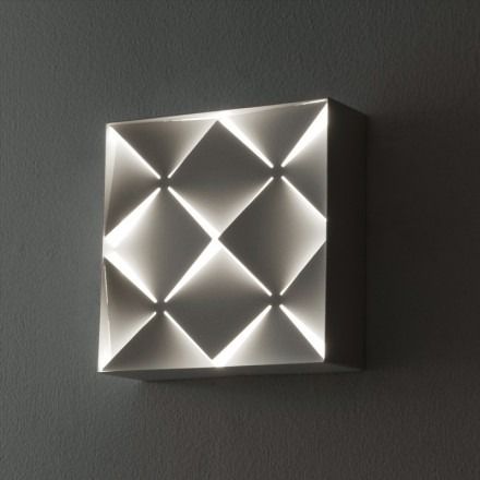 A white faceted metal housing creates incredible shadow patterns for a functional optical illusion! Alabaster White, Led Flood Lights, Energy Efficient Lighting, Fluorescent Light, Led Flush Mount, Metal Homes, Light Sconces, White Metal, Rectangle Shape