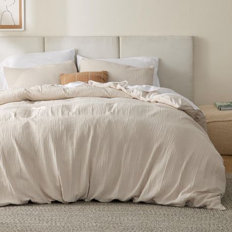 PRICES MAY VARY. Faux-Muslin Waffle Wave: The faux-muslin design with a waffle texture on this duvet cover set elevates your home decor with its elegant and sophisticated charm. Lightweight: Featuring a naturally wrinkled faux-muslin texture, this duvet cover set is naturally airy, lightweight, and breathable. Durable and Safe: The duvet cover set is woven with even and dense stitching, providing increased durability against pulls and snags. It is also Standard 100 by OEKO-TEX certified for its Off White Duvet Cover, Amazon Duvet Cover, Tan Comforter Bedroom Ideas, Oatmeal Bedding, Lakehouse Remodel, Greige Bedroom, Beige Duvet Cover, Waffle Duvet Cover, Beige Duvet