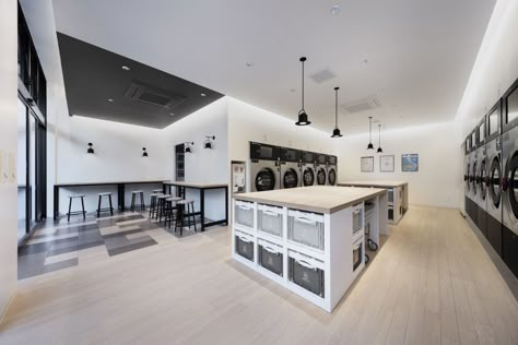 Marui Toclus, by nendo, is a new shared residence in Tokyo, Japan, that turns from store to dwelling at night. Laundromat Ideas, Laundry Cafe, Laundromat Business, Coin Laundry, Laundry Business, Commercial Laundry, Laundry Shop, Laundry Mat, Laundry Design