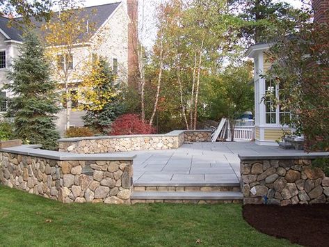 Patios bring life and function to your landscape. A sloped landscape can be easily traversed with walks, steps, and a patio for outdoor living. Sloped Landscape, Cottage Deck, Patio Walls, Hardscape Ideas, Pavers Design, Backyard Goals, Cottage Patio, Stone Patios, Brick Porch