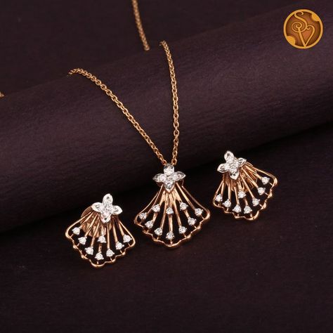 This 18kt Rose gold pendant Set is embellished with round brilliant diamonds.

Note: The given price is only for the pendant and Earrings, it does not include the Chain. Small Pendents Design, Pendent Earrings Set Gold, Small Pendent Set Diamond, Diamond Pendant Sets Unique, Pendent Set Gold, Diamond Pendent Set, Rose Gold Pendant Set, Jewellery Poster, Gold Pendant Set