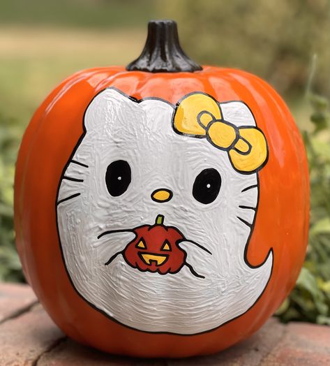 White Pumkin Painting, Cute Pumkins Ideas Painting Preppy, Baddie Pumpkin Painting, Painted Hello Kitty Pumpkin, Pumpkin Painting Ideas Sanrio, Fall Themed Painted Pumpkins, Coquette Pumpkin Painting Ideas, Squishmallow Pumpkin Painting, Goth Pumpkin Painting