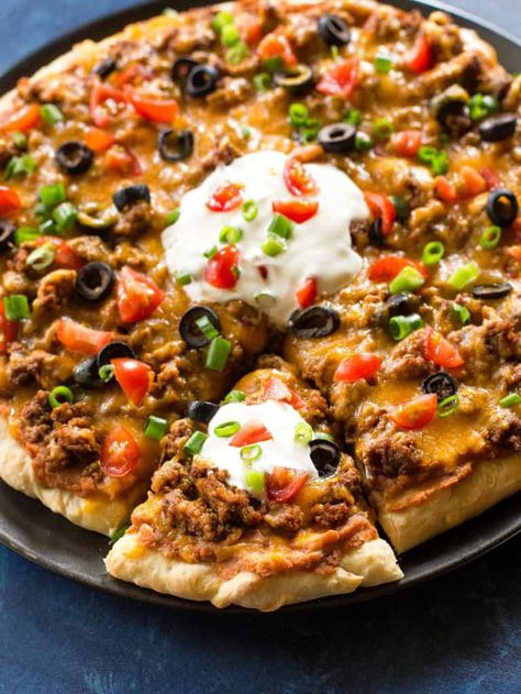 This Taco Pizza is Mexican meets Italian. Pizza dough topped with beans, salsa, beef, cheese, and all the toppings. Switch up your Taco Tuesday with this easy delicious meal! Easy Mexican Pizza, Taco Pizza Recipe, Easy Taco Pizza, Taco Pizza Recipes, Mexican Pizza Recipe, Homemade Taco Seasoning Mix, Homemade Refried Beans, Easy Taco Recipes, Homemade Mexican