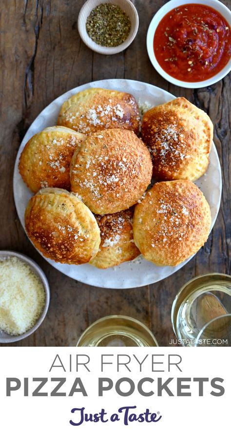 A top-down view of air fryer pizza pockets piled on a white plate next to a small bowl filled with pizza sauce and a small bowl filled with grated parmesan cheese. How To Cook Pizza, Pizza Pockets Recipe, Air Fryer Pizza, Biscuit Pizza, Pizza Pockets, Crispy Cheese, Cooking Pizza, Canned Biscuits, Biscuit Dough