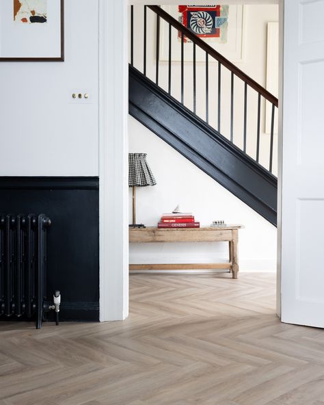 Simple and timeless; an ode to the classic herringbone floor with Croft Oak Rosehip Herringbone. We love this elegant look for a hallway, especially contrasting with the black paintwork and on trend, unexpected pops of red. Shop free samples online ❤ #flooring #lvtflooring #luxuryflooring #herringbonefloor #woodfloor #home #homeinspo #homeinterior #homesweethome #luxuryhome #luxestyle #luxuryinterior Hallway Herringbone Floor, Floorboards Hallway, Herringbone Hallway, Black And White Hallway, Blue Flooring, White Stove, Stove Black, Rustic Kitchens, Floor Designs