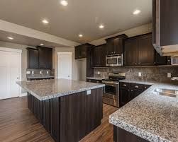 sarsaparilla maple cabinet and new caledonia granite - Google Search New Caledonia Granite, Caledonia Granite, Cost Of Granite Countertops, Maple Cabinet, Dark Cabinets Backsplash, Painted Ceilings, Hudson Homes, Maple Cabinets, Granite Countertops Kitchen