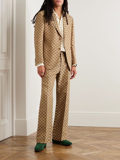 This suit jacket feels both joyfully retro and quintessential to Gucci's current era. It's tailored from naturally breathable linen-blend that's woven with monograms in a '70s-inspired, earthy colourway.