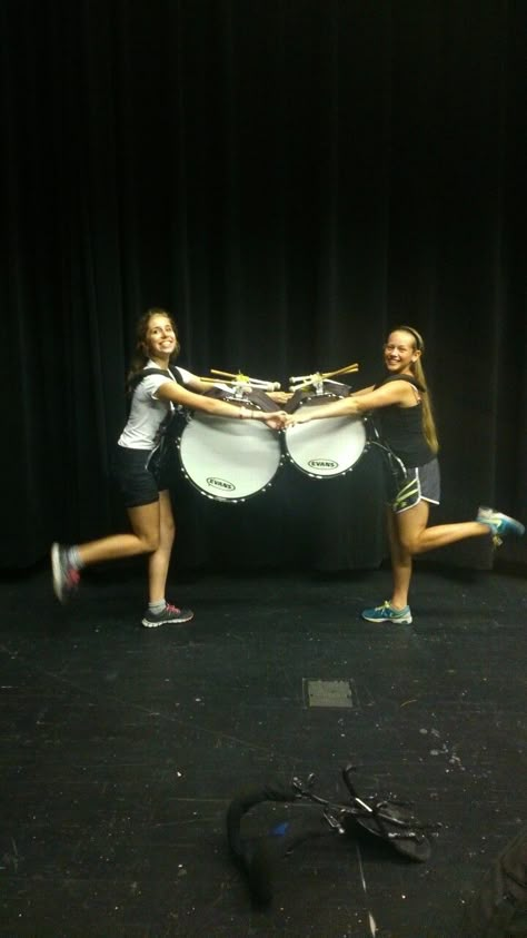 Carrying a bass drum is hard! In order to be able to march, these girls had to find their center of mass. When an object is at it's center of mass, it will remain in equilibrium, or balanced. The girls have to hold onto each other when they lean forward because their center of mass is not concentrated. Bass Drum Aesthetic, Marching Band Bass Drum, Bass Drum Marching Band, Drumline Aesthetic, Marching Bass Drum, Drum Drawing, Drums Girl, Marching Drum, Band Trip