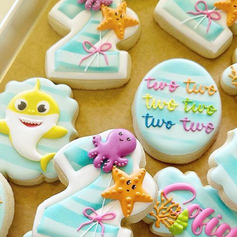 Sarah on Instagram: "I dare you not to sing! 🎶 baby shark two-two-two🎶 Inspo from @sistersweetsbakeshop #babysharkcookies #hamptonva #yorktownva" Baby Shark Birthday Party Girl Two, Baby Shark Cookies Decorated, Baby Shark 2nd Birthday Party Girl, Baby Shark Cupcakes, Baby Shark Cookies, Baby Shark Sugar Cookies, Boys Second Birthday Baby Shark, Baby Shark Cookies 2nd Birthday, Pastel Baby Shark Party