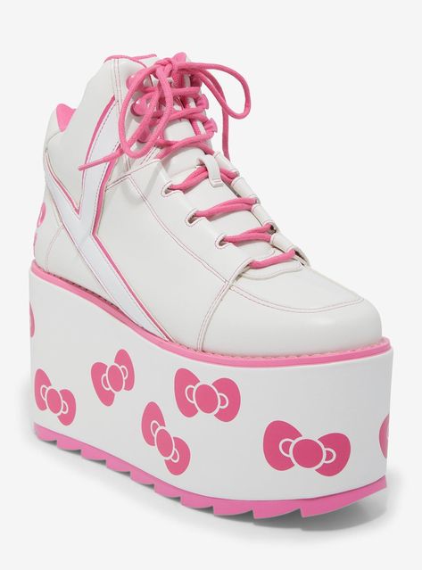 Step into cuteness overload with these Hello Kitty x YRU platform sneakers! Featuring white faux leather with pink accents and adorable Hello Kitty bow prints on the platforms.Listed in women's sizes.Platform: 3''Heel: 4''Polyurethane upper & rubber soleImported Cutecore Sneakers, Pink Kawaii Clothes, Kawaii Clothes Pink, Kawaii Platform Shoes, Cute Pink Shoes, Yru Shoes, Platforms Shoes, Cut Shoes, Hello Kitty Gifts