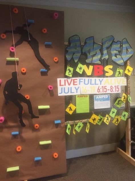 rock climbing wall part w/ silhouette. HOW DO I MAKE THIS Rock Climbing Decorations, Rock Climbing Party Decorations, Ready Set Move Vbs Decorating Ideas, Rock Climbing Decor, Orange Vbs Ready Set Move Decorating Ideas, Ready Set Move Vbs Decorations, Ready Set Move Vbs, Orange Vbs, Sports Vbs