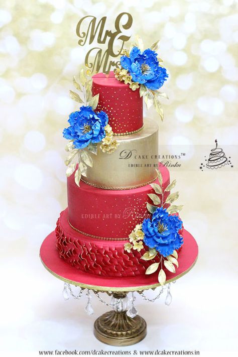 Red & Gold Wedding Cake with Royal Blue Flowers Coral Wedding Cakes, Red Gold Wedding, Indian Cake, Royal Blue Flowers, Blue Costumes, Royal Colors, Gold Cake, Light Coral, Gold Wedding Cake