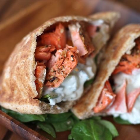 Salmon Gyros - it's hard to go wrong with salmon in our house. Tasty combo, but make less yogurt sauce next time. Salmon Gyros, Salmon Pita, Pita Sandwich, Pain Naan, Gyro Recipe, Broiled Salmon, Healthy Salmon, Healthiest Seafood, Dinner Meal