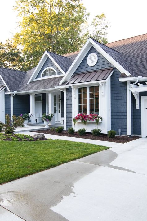 Lake House Exterior - Dark grey charcoal vinyl shake siding with white trim, pergola, window boxes and corbel details. Blue With White Trim House, Blue Grey White House Exterior, Exterior Paint Colors For Bilevel House, Navy House With White Trim, Mastic Natural Slate Siding, Navy Exterior House Colors White Trim, Dark Blue Houses With White Trim, Navy Blue And White House Exterior, Colorful House Exteriors