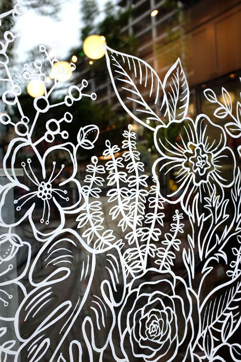 Flower Window Art, Window Mural Painting, Drawing On Glass Ideas, Summer Window Art, Spring Window Art, Spring Window Painting, Window Art Ideas, Hand Painted Windows, Window Drawings