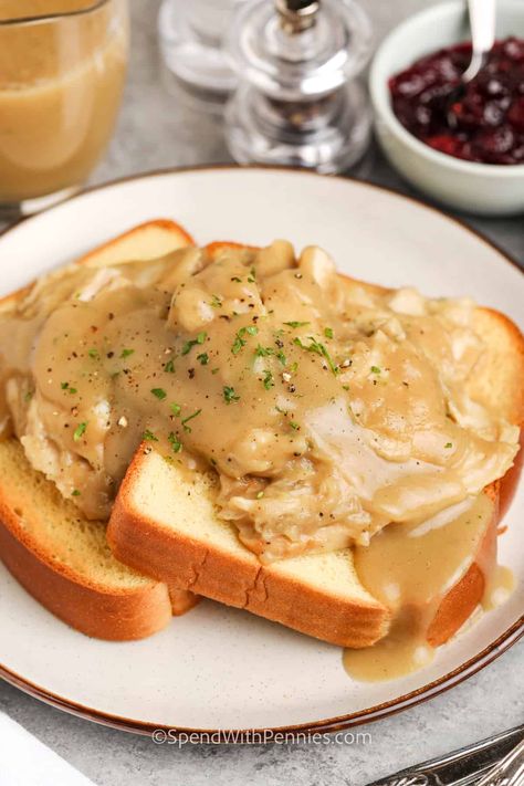 A hot turkey sandwich is an easy supper that's made with gravy and is a great way to use up leftovers from a holiday dinner. Recipes like this one are sure to become family favorites! It's simple to dress it up with bacon or melted cheese, too. Try it with cranberry sauce or make a tasty avocado mayo. #turkeysandwich #hotturkeysandwich #leftovers #spendwithpennies Open Face Turkey Sandwich Gravy, Turkey And Gravy Sandwiches, Hot Turkey Sandwich With Gravy, Open Faced Turkey Sandwich, Sandwiches Board, Hot Turkey Sandwich, Turkey Sandwich Recipes, Open Face Turkey Sandwich, Homemade Turkey Gravy