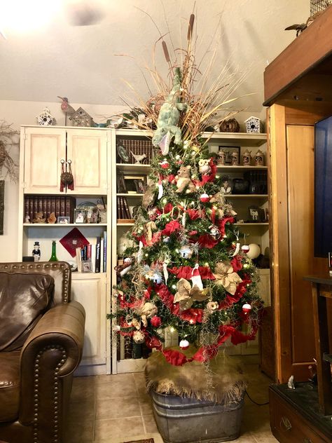 This year we’re having a Cajun Christmas. Mom’s Cajun, so she’s going to read the Cajun Night Before Christmas book to our 17 grandkids on Christmas Eve. I decorated the tree with a real turtle shell, an alligator head, oyster shell Santas, okra Santas, bobbers, and Spanish Moss for that Cajun tree feel. We’re having gumbo, boudin dip, and gator sausage. Mom’s turning 88 in a few days. Merry Christmas Sha! Cajun Night Before Christmas Decorations, Cajun Christmas Tree, Cajun Christmas Decorations, Boudin Dip, Cajun Night Before Christmas, Real Turtle, Alligator Head, Cajun Christmas, Louisiana Cajun