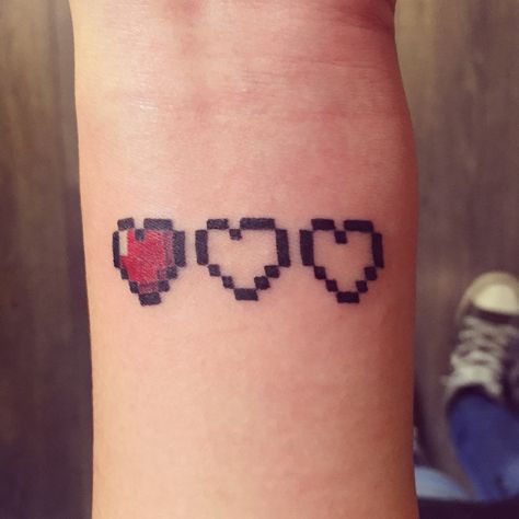 Pixel hearts tattoo Pixel Heart Tattoo, Minecraft Tattoo, Pixel Tattoo, Hearts Tattoo, Gamer Tattoos, Pixel Heart, Gaming Tattoo, Tattoo Videos, Nail Tattoo