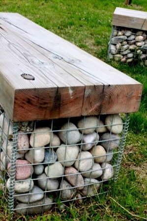 A gabion basket filled with pebbles and topped with a timber seat made from salvaged timbers from the old Weston-super-Mare Pier that was destroyed by fire. Gabion Bench, Rock Bench, Yard Seating, Gabion Garden, Stone Seating, Spa Steps, Swim Pond, Gabion Walls, Gabion Baskets