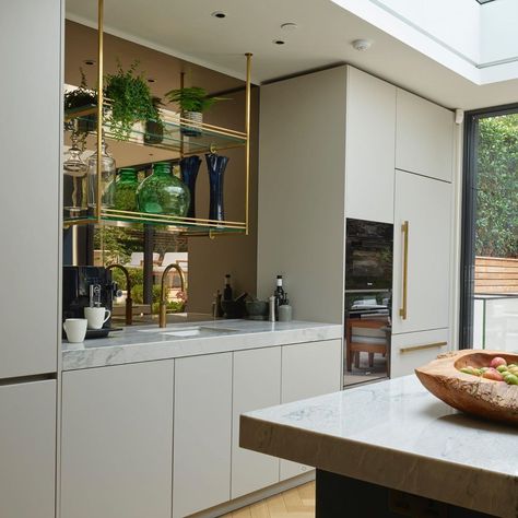 Roundhouse on Instagram: “Suspended brass shelves, brass handle details and a Bronze mirror splashback add a touch of luxury...and dare we say it...glamour...to this…” Mirror Splashback Kitchen, Bronze Mirror Splashback, Brass Shelving, Kitchen Centerpiece, Kitchen Showroom, Bronze Mirror, Mirror Design Wall, Kitchen Splashback, Art Deco Home