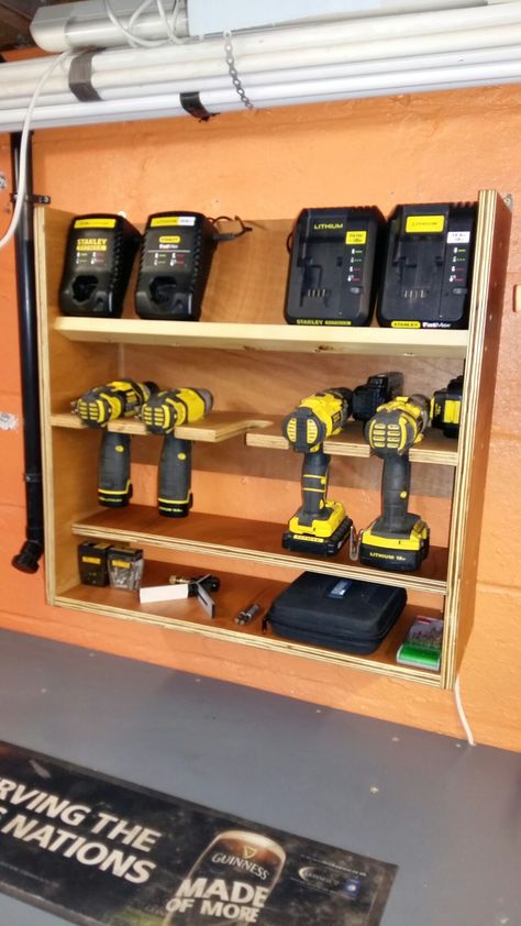 Workshop battery drill charging station easy diy plywood project Drill And Charger Storage, Drill Charger Station Diy, Charging Station Ideas Garage, Garage Battery Charging Station, Ryobi Battery Charging Station, Charging Station Ideas, Battery Charging Station, Battery Drill, Garage Workshop Organization