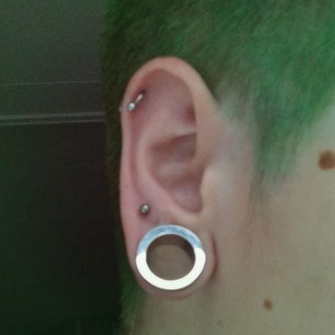 Boy with stretched earlobe with 16 mm tunnel, 2nd lobe piercing and helix piercing 0g Stretched Ears Aesthetic, 2nd Lobe Piercing, Multiple Stretched Lobes, 16mm Stretched Ears, Stretched Ears Girl, 25 Mm Stretched Ears, Goth Stretched Ears, Double Ear Piercings, Ear Lobe Piercings