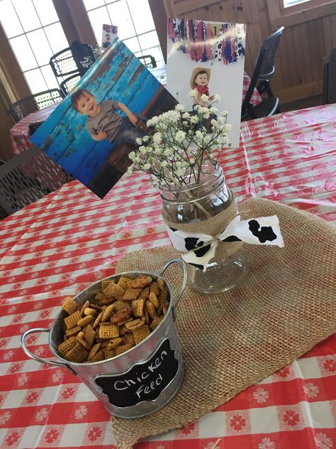 Hay Centerpieces Birthday Parties, Cow Birthday Party Table Decor, Cow Party Table Decor, Cow Party Centerpiece Ideas, Cowboy 1st Birthday Party Centerpieces, Cow Birthday Party Centerpieces, Cowprint Birthday Centerpieces, Cow Table Centerpieces, Cow Centerpieces Farm Birthday