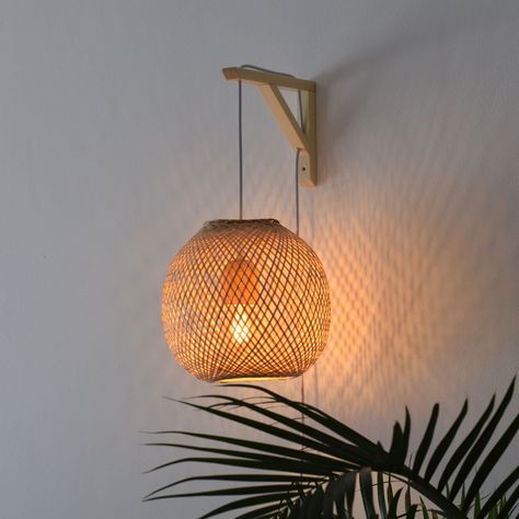 Please expand this item details section to read the full details and description. A traditionally handwoven Thai bamboo trap basket, re-purposed into a beautifully minimalistic wall bracket pendant light. [ About ] A classic example of Asian craftmanship, these fishing traps are handwoven from natural bamboo using techniques that are centuries old. We've modified an aspen bracket to create a beautiful wall mounted pendant, perfect for placing anywhere in the home. It is light enough to be stuck Bamboo Wall Light, Hygge Bedroom Lighting, Wall Mount Pendant Light, Hanging Lamp Decor, Bedside Hanging Lights Plug In, Asian Style Bedrooms Interior Design, Boho Hanging Baskets, Neutral Bedroom Lighting, Rattan Wall Lights