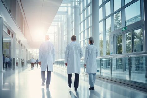 Medical workers walk along a hospital corridor. Doctors and healthcare specialists in personal protective equipment take royalty free stock image Hospital Corridor, Take Photo, Healthcare Workers, Personal Protective Equipment, Landscape Photos, Stock Images Free, Health Care, Medicine, Photo Image