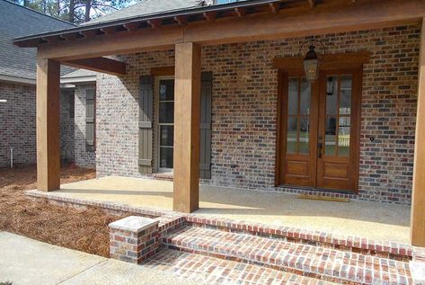 The Front Porch Of This Home Has Columbus Brick In The Tavern Hall Selection Which Compliments The Dark Wood Porch Columns. #frontporch #brickonfrontporch #porchbrick Wood Porch Columns, Porch Beams, Front Porch Posts, Red Brick Exteriors, Brick Companies, Sustainable Building Materials, Wood Columns, Ranch Exterior, Porch Columns