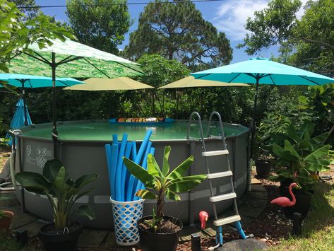 Create shade by attaching umbrellas with a pvc pipe stand to the pool leg! Diy Pool Shade Ideas, Diy Pool Shade, Shade For Above Ground Pool, Above Ground Pool Umbrella Ideas, Above Ground Pool Set Up, Above Ground Pool Shade Ideas, Above Ground Pool Shade, Pool Shade Ideas, Above Ground Pool Accessories