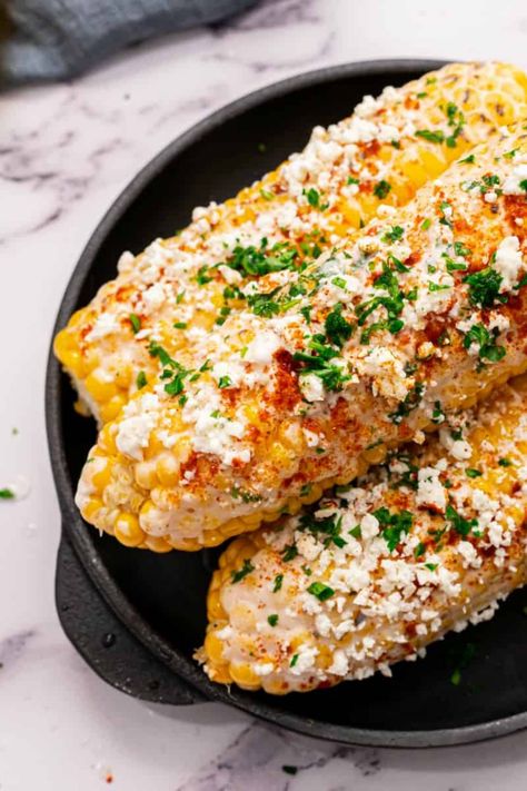 The Pioneer Woman Mexican Street Corn is a staple of the summer and you can make it yourself. Top char-grilled corn on the cob with a tangy, creamy sauce, sprinkle with crumbled cheese, and dig in. Perfect for a backyard barbecue! Elote Preparado, Mexican Corn Recipes, Elote Corn, Elote Recipe, Mexican Street Corn Recipe, Street Corn Recipe, Tastes Better From Scratch, Mexican Snacks, Mexican Corn