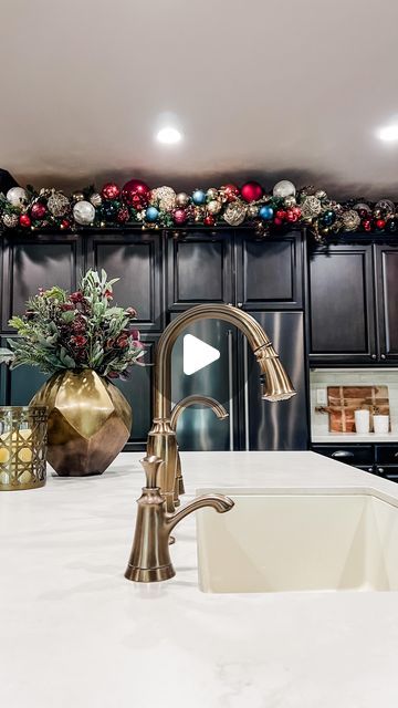 Jeanna Crawford on Instagram: "Do you have this spot, too? ❤️

You either love it or you wonder why you have it... but now that you’ve seen this, you know what to do with it! 

The “above cabinets” kitchen Christmas garland is always one of my most popular creations because it takes a space that is a struggle for many and transforms it with Christmas magic!

What do you think?

#Christmastrends #Christmaskitchen  #Christmasgarland #Christmascabinets #christmas #christmasdecor #christmasdecorations" Christmas Garland On Kitchen Cabinets, Above Cabinet Garland, Garland On Cabinets, Garland Kitchen Cabinets, Above Kitchen Cabinet Christmas Decor, Garland Above Kitchen Cabinets, Above Cabinet Christmas Decor, Christmas Decor Above Kitchen Cabinets, Kitchen Cabinet Christmas Decor