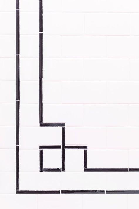 Pencil Tiles Bathroom, White Subway Tile With Black Pencil Trim, White Subway Tile With Black Trim, Art Deco Kitchen Tile Backsplash, Black White Subway Tile Bathroom, Striped Subway Tile Bathroom, Pencil Tile Trim Bathroom, Square Line Pattern, Inlay Tile Floor