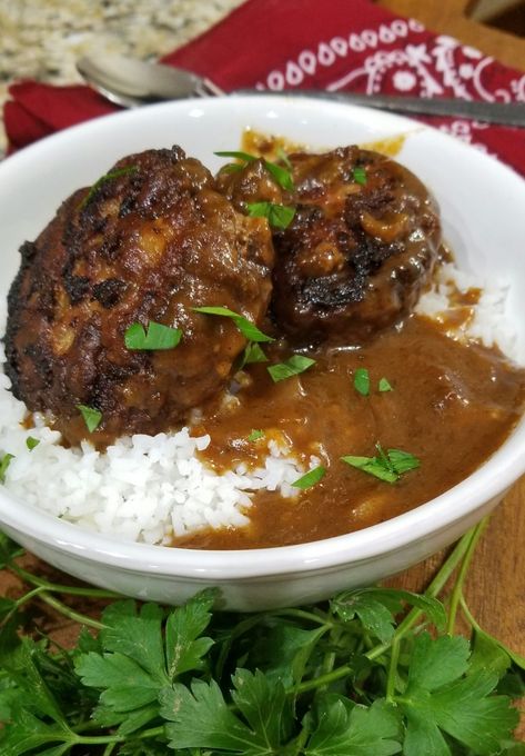 Hamburger steak should be on everybody’s weekly dinner lineup. The hamburger steak is super tender and the onion gravy is so simple yet seasoned just right.  Prep time: 15 minutes Cook time: 20 to 30 minutes Serves: 6 to 8 Ingredients: Hamburger patties: 3 T of cooking oil 3 T. Butter 2 lbs. of ground burger 1 small onion, finely chopped 2 large egg 1 tsp.... Read More Hamburger And Rice Recipes, Japanese Hamburger Steak, Hamburger Steak Recipes, Hamburger Steak And Gravy, Hamburger Gravy, Rice And Gravy, Steak And Rice, Minced Meat Recipe, Beef Steak Recipes