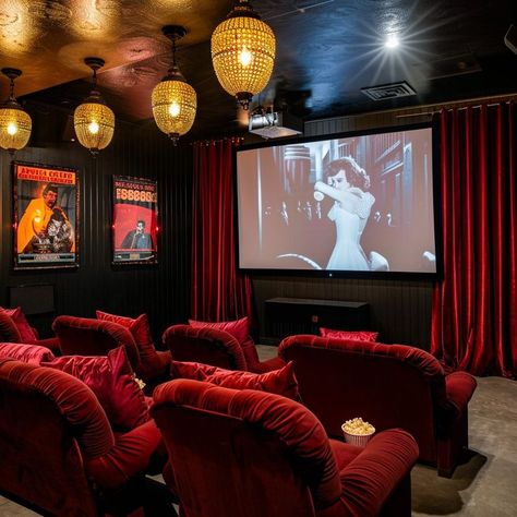 Vintage glamour home cinema room with red velvet seats, vintage film posters, and ornate lantern-style lighting fixtures, creating an intimate viewing experience. Home Cinema Room Ideas, Vintage Film Posters, Theatre Room Ideas, Movie Theater Rooms, Film Screening, Glamour Home, Home Cinema Room, Dream Life House, Woman Cave