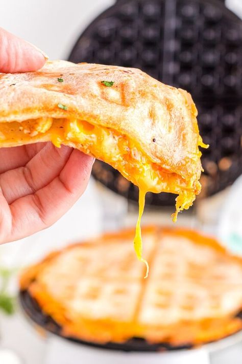 This Quesadilla in a Waffle Maker is incredibly easy to make by adding your preferred quesadilla fillings and cooking in a Belgian waffle maker. The outcome is a crispy-edged quesadilla with a delectable, melted cheesy filling!If you love fun, Mexican-inspired recipes you'll also enjoy my Taco Bell Cheese and Nacho Fries copycat recipes! This recipe is fun for a brunch party where you can offer your guests a sweet and savory waffle bar. Set up a couple of waffle makers and guests can… Quesadilla Fillings, Easy Quesadilla, Quesadilla Recipes Easy, Quesadilla Maker, Parsnip Fries, Nacho Fries, Vegetarian Substitutes, Marinara Recipe, Waffle Maker Recipes