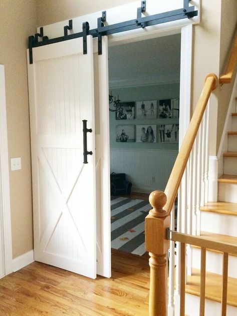 We converted our dining room into a play room since we weren't using it much and need an area for our children to play. However, the doorway into it was rather large. It was not really meant for a bedroom door, but we wanted to be able to close it off so we could hide the mess of toys. This is how we came up with the idea to add barn doors. We went to Lowe's and bought the wood, it required tongue and groove and 1x4's and 1x6's. We also got a sander, primer, and paint. I ordered the ba… Large Doorway Door Ideas, Large Doorway Ideas Room Dividers, Dining Room Converted To Bedroom, Large Doorway Ideas, Framing Doorway, Mirror Barn Door, Cheap Closet, Barn Door Pantry, Double Sliding Barn Doors