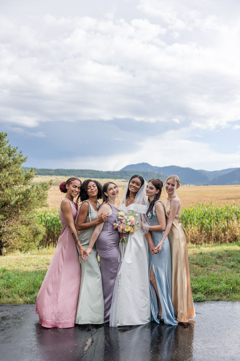 Mix and match your pastel bridesmaid dresses for a whimsical wedding look! 💐 Featuring Satin Charmeuse bridesmaid dresses in Sage Green, Purple Haze, Rose Quartz, and Crystal Satin in Baby Blue and Light Gold. The bride wears our Lina Wedding Dress. Bridesmaid Dresses Pastel Colours, Satin Blue Bridesmaid Dresses, Purple And Blue Bridesmaid Dresses, Bridesmaids Palette, Pastel Purple Bridesmaid Dresses, Bridesmaid Dresses Pastel, Pastel Colour Bridesmaid Dresses, Pastel Bridesmaids Dresses, Matching Bridesmaid Dresses