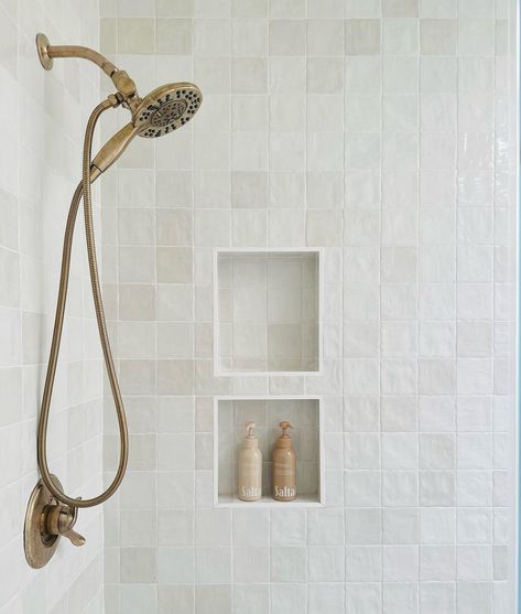 Design by cornell_lane #tileideas, #tiledesign, #tilefloor, #homedecor, #hometile, #tile, #bathroomtile, #bathroomdesign, #bathroomfloor, #bathroomtiledesign, #modernhomedesign, #modernbathroom, #bathroomtileideas, #uniquetiledesign, #bathroomrenovation, #tilerenovation, #showertile, #showertiledesign, #showertileideas, #showerdesign, #showerideas, #showerdesignideas Primary Bathroom Tile, Shell Shower Head, Warm Wood Kitchen Cabinets, White Tile Shower Ideas, Warm Wood Kitchen, Taupe Bathroom, White Tile Shower, Timeless Kitchen Design, Bathroom Tile Ideas