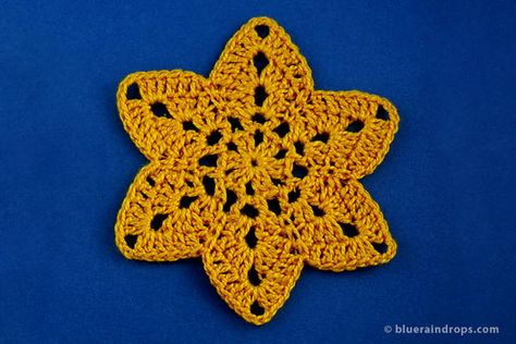 If you are looking for a fun and easy holiday project, follow this free pattern and make a bunch of cute six pointed stars. Use them as ornaments on your tree, make a garland or use them as appliques any time of the year.I made my warm yellow Six pointed Star Crochet Motif with cotton thread No 5 and a 2,5 mm crochet hook and its final size is 9 cm (3,5 inches) in diameter. Besides the pattern, you can find here a very helpful free blocking template! Star Crochet Pattern, Crochet Shapes, 8 Pointed Star, 6 Point Star, Make A Garland, Six Pointed Star, Crochet Doily Rug, Dress Up Clothes, Lovey Crochet