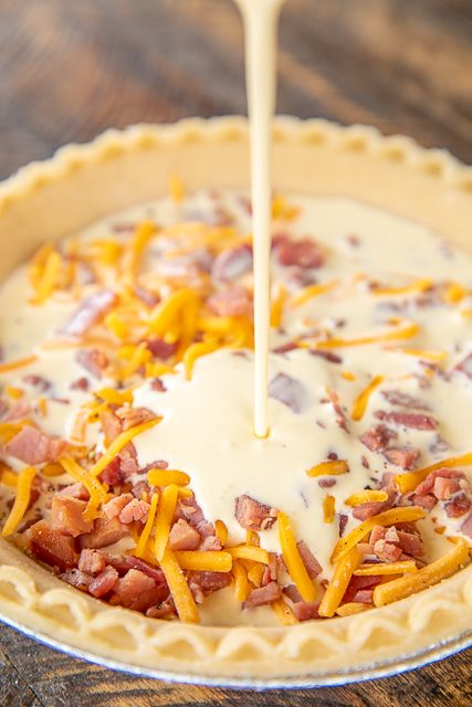 Honey Ham and Cheese Quiche - can be made ahead of time and refrigerated and even frozen for later. Great for breakfast, lunch or dinner! Ham, cheese, eggs, honey mustard, sour cream, heavy cream and pepper. Great way to use up leftover holiday ham. This never lasts long in our house! Dinner Ham, Ham And Cheese Quiche, Breakfast Quiche Recipes, Quiche Recipes Easy, Honey Ham, Honey Baked Ham, Holiday Ham, Cheese Quiche, Breakfast Quiche