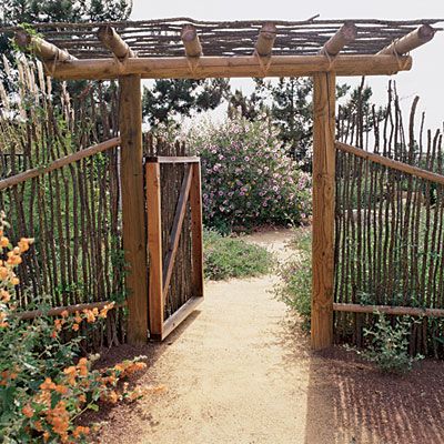 Native fence    A decomposed granite path passes through a fence and gate made from Ocotillo (Fouquieria splendens), a Southwest native.    The winding walkway invites exploration of more of this casual low-water landscape. Low Water Landscaping, Deer Resistant Garden, Garden Gate Design, Deer Fence, Garden Fencing, Gorgeous Gardens, Garden Structures, Garden Fence, Rustic Gardens