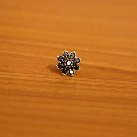 A black stone nose pin looks very pretty on any woman. Pick from a wide variety of nose pin collections from Kalyan. Nose Pin Gold, Nose Pin Designs, Latest Diamond Jewellery, Diamond Jewellery Designs, Kalyan Jewellers, Stone Jewellery Designs, Designer Diamond Jewellery, Creative Birthday Gifts, Nose Pin