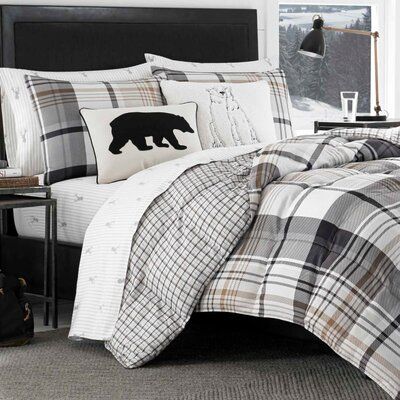 Eddie Bauer Soft and silky brushed microsuede lends extra warmth and comfort to this handsome plaid comforter set. The large scale of the main plaid creates a fresh, modern attitude to this classic design and the sophisticated neutral palette of black, beige and white with a color accent of coppery tan will complement both rustic and modern décor. Size: Twin Comforter +1 Sham | Eddie Bauer Normandy Plaid Reversible Comforter Set, Polyester/Polyfill/Polyester in Brown/Ivory/Cream, Size Twin Comfo Black Comforter Sets, Plaid Comforter, Black Comforter, Plaid Bedding, Twin Comforter Sets, Twin Comforter, King Comforter Sets, Queen Comforter Sets, Bedding Stores