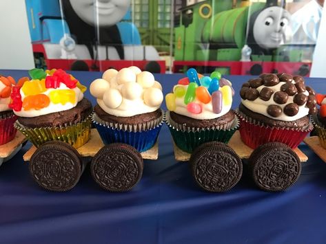 You don't have to be a cake decorator to be able to make this adorable Thomas the Tank Engine candy cupcake train for your little fella's birthday! It's easy, peasy to do. If you're planning a birthday party for your little boy, and he loves trains, you can't go wrong with this cute cake idea! #thomasthetankengine #thomascake #birthdayboy #thomas #toddler #partytime #celebrate #birthdayparty #party #thomascake #kidbirthday #sixcleversisters Train Cupcake Cake, Cookie Village, Train Birthday Party Cake, Cupcake Train, Thomas Cupcakes, Cupcake Cake Ideas, Train Cupcakes, Thomas Party, Train Theme Birthday Party