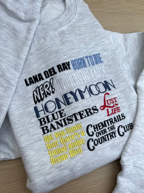 Lana Del Rey Embroidery, Album Names, Lana Del Rey Fan, Lana Del Rey Shirt, Embroidery Shirts, Lana Del Ray, Embroidered Crewneck, Shirt Embroidery, Embroidered Sweater