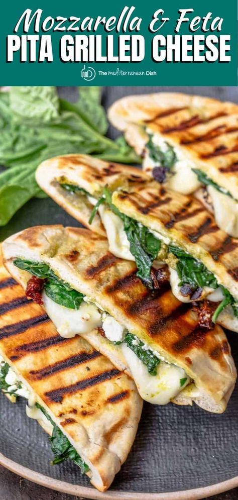 Not your average grilled cheese sandwich! Pita Grilled Cheese w Mediterranean faves like mozzarella, feta, sundried tomatoes, basil pesto. Sommer Mad, Panini Recipes, Plats Healthy, God Mat, Mediterranean Dishes, Mediterranean Diet Recipes, Grilled Cheese, Mediterranean Recipes, Veggie Recipes