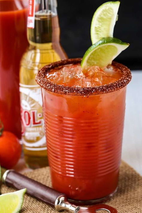 Try a Michelada for happy hour tonight! This spicy beer cocktail is one of our favorites to make, any time of the year! #michelada #beer #cocktails #drinks #drinkrecipes Mexican Cocktail, Limeade Drinks, Michelada Recipe, Mexican Cocktails, Special Drinks, Beer Cocktail, Octoberfest Food, Mix Drinks, Spicy Chicken Recipes